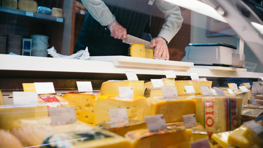 buying cheese at a cheese counter